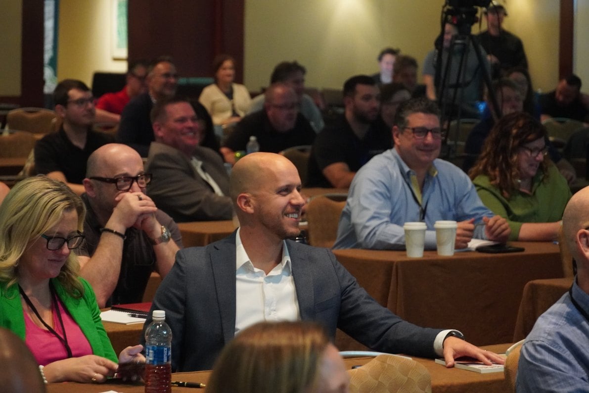 Owners seated through a general session at an iGo conference