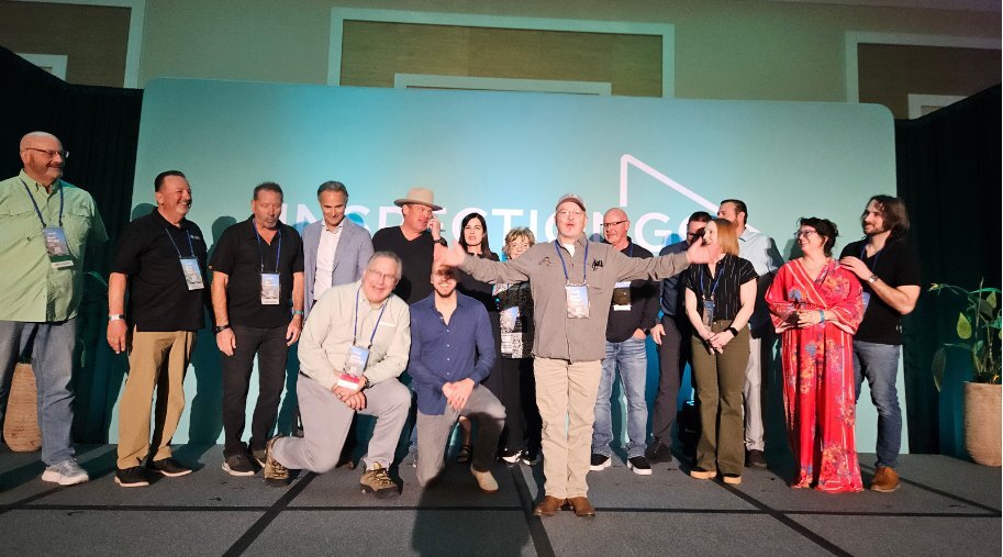 Members gathered on stage at an iGo conference