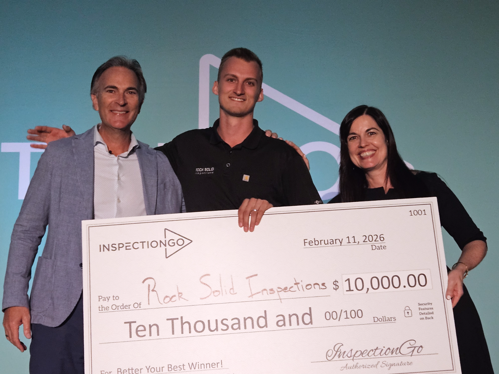 The Better Your Best winner accepting the $10,000 check on stage